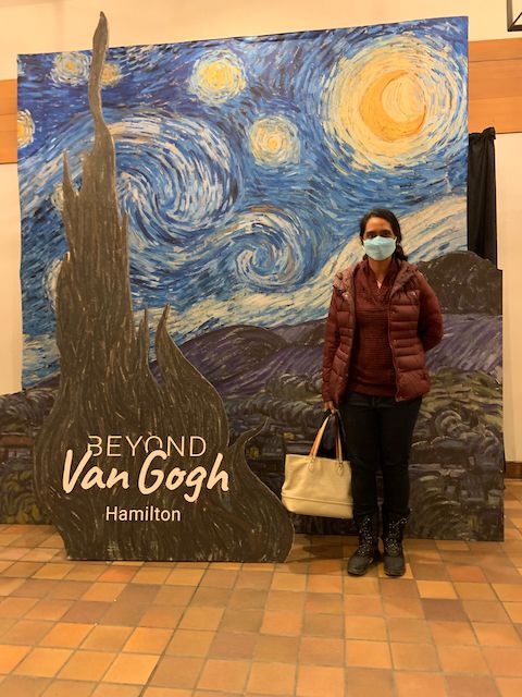 Image of me against a backdrop of The Starry Night at 'Beyond Van Gogh' Hamilton