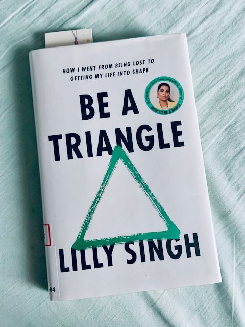 Paperback copy of Be A Triangle by Lilly Singh