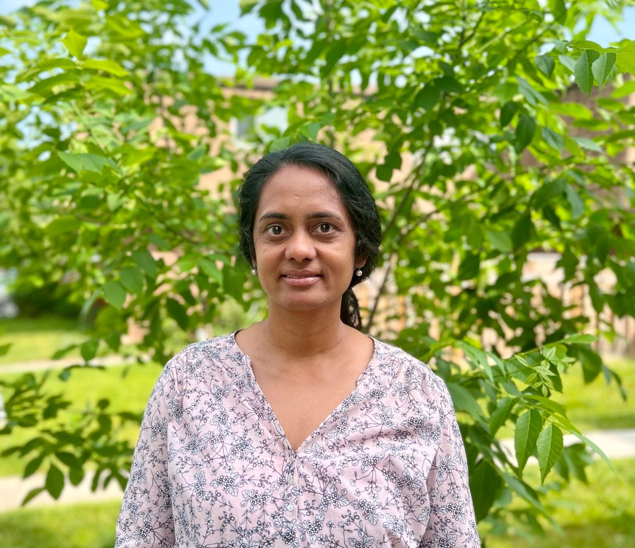 Image of myself against green foliage in the background