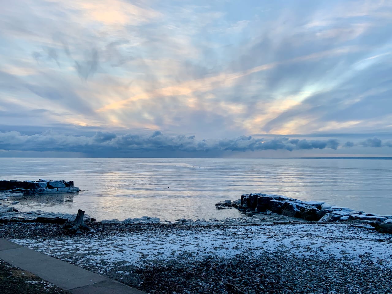 looking at Lake Ontario from a snow-filled shore