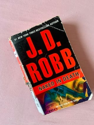 paperback copy of Naked in Death by J. D. Robb