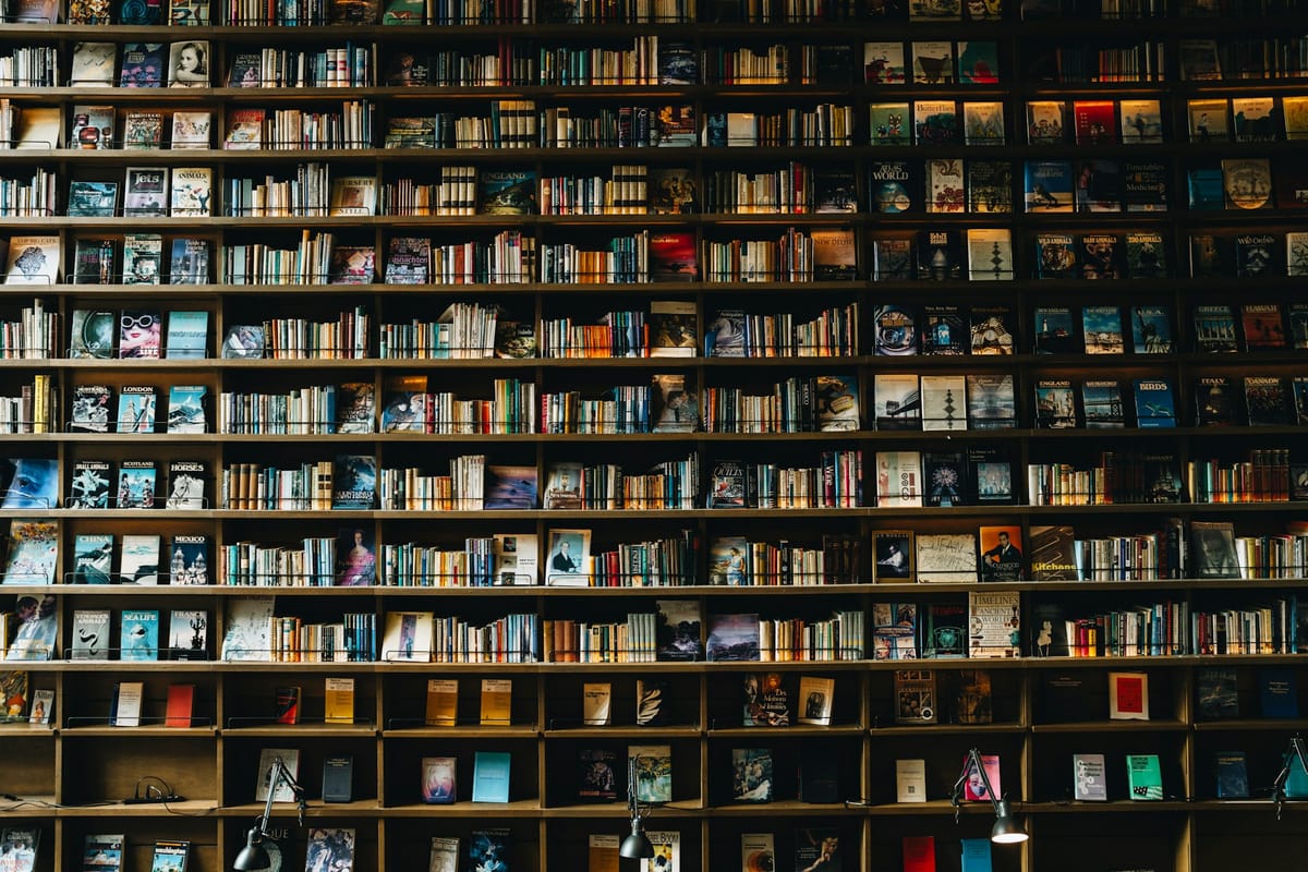 a wall full of book shelves packed with books