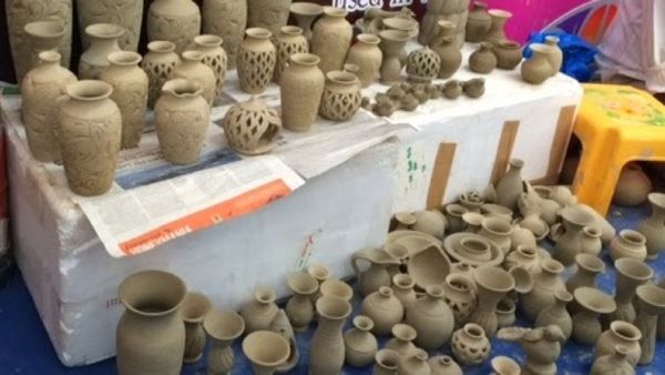 a cluster earthen pots, as yet unpainted