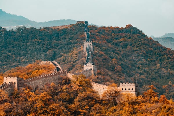 the Great Wall of China nestled among mountains and trees