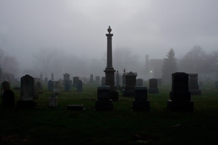 cement tombs in the morning mist