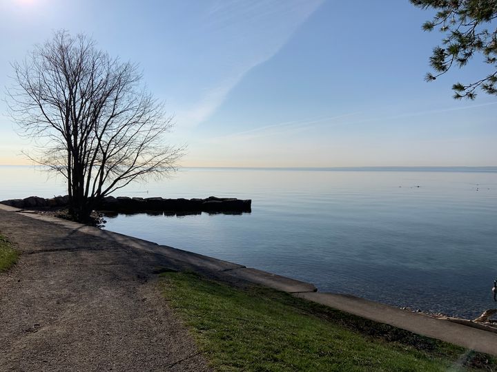 view of a lake under a blue sky