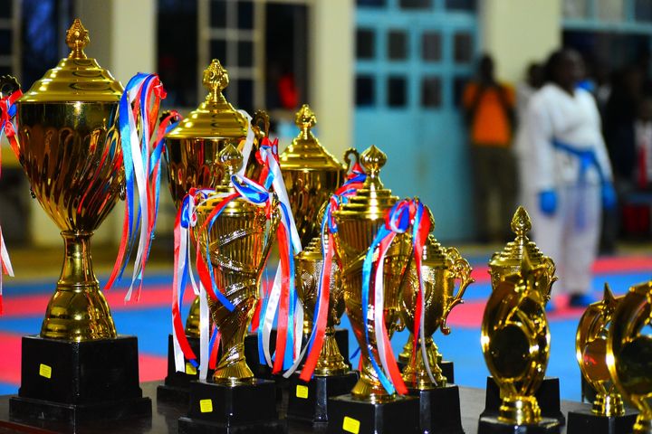 rows of trophies and medals on display