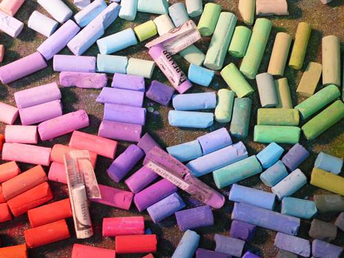 colourful chalk pieces strewn on the ground