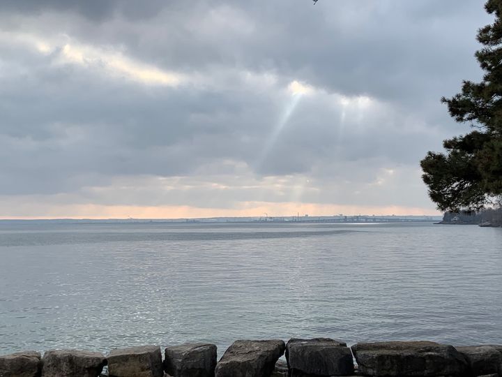 sunbeams coming through dark clouds in the sky