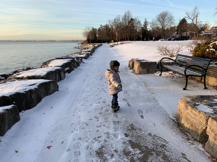 Little D pointing to his bootprints in the snow