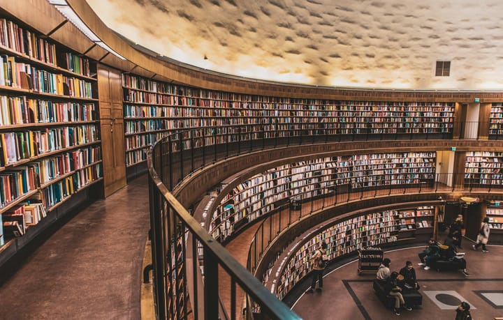 books on shelves on three floors of a bookstore