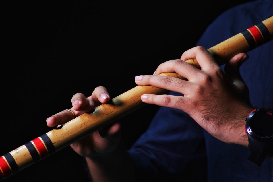 Person playing bamboo flute